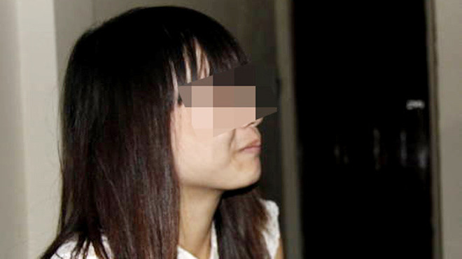 Nghiêm Thị Thư tức tưởi kể về những ngày tủi nhục của mình. Ảnh: Tuổi trẻ Nghiêm Thị Thư tức tưởi kể về những ngày tủi nhục của mình