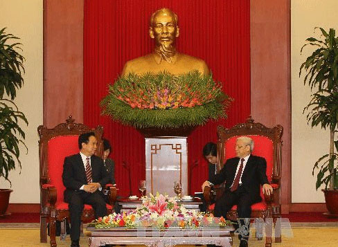 Tổng Bí thư Nguyễn Phú Trọng tiếp đồng chí Lý Kiến Quốc (Ảnh: Trí Dũng/TTXVN) 