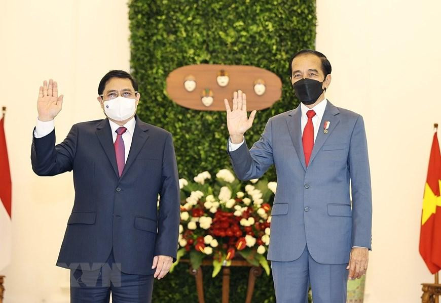 Thủ tướng Phạm Minh Chính và Tổng thống Indonesia Joko Widodo.Ảnh: Dương Giang/TTXVN