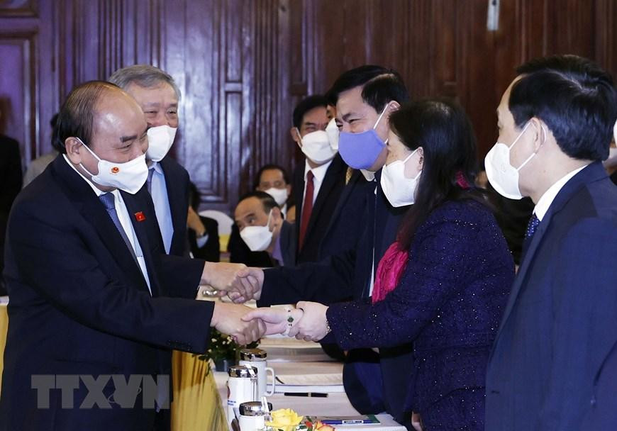 Chủ tịch nước Nguyễn Xuân Phúc với các đại biểu tham dự hội thảo. (Ảnh: Thống Nhất/TTXVN) Chủ tịch nước Nguyễn Xuân Phúc với các đại biểu tham dự hội thảo. (Ảnh: Thống Nhất/TTXVN)