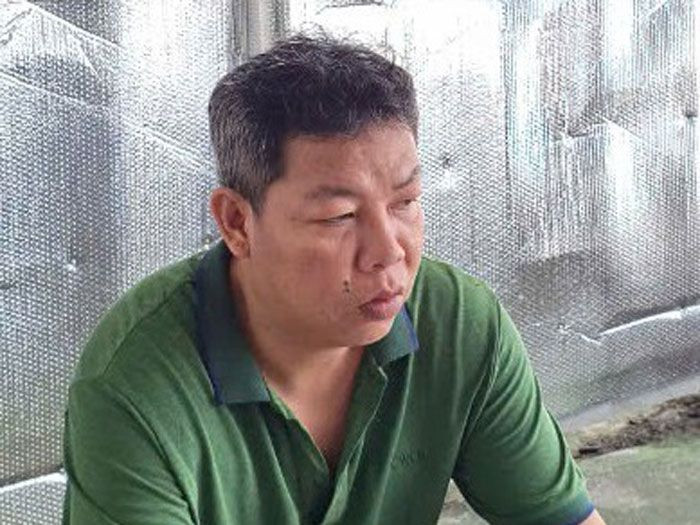 Nguyễn Quốc Tân tại cơ quan công an. Ảnh: Nghiêm Túc.