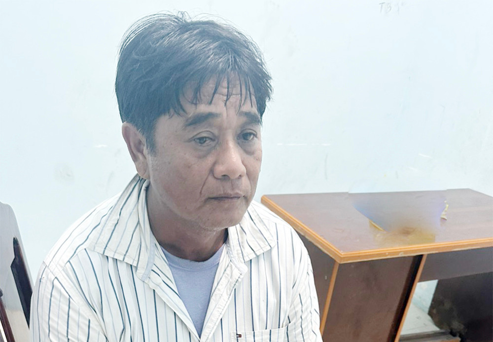 Lê Văn Đol tại cơ quan công an. Ảnh: Tiến Tầm.