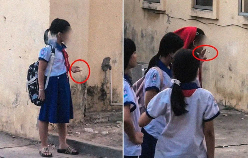 Nhóm các em nữ mặc đồng phục, hút thuốc lá được cho trong khuôn viên trường. Ảnh cắt từ clip.