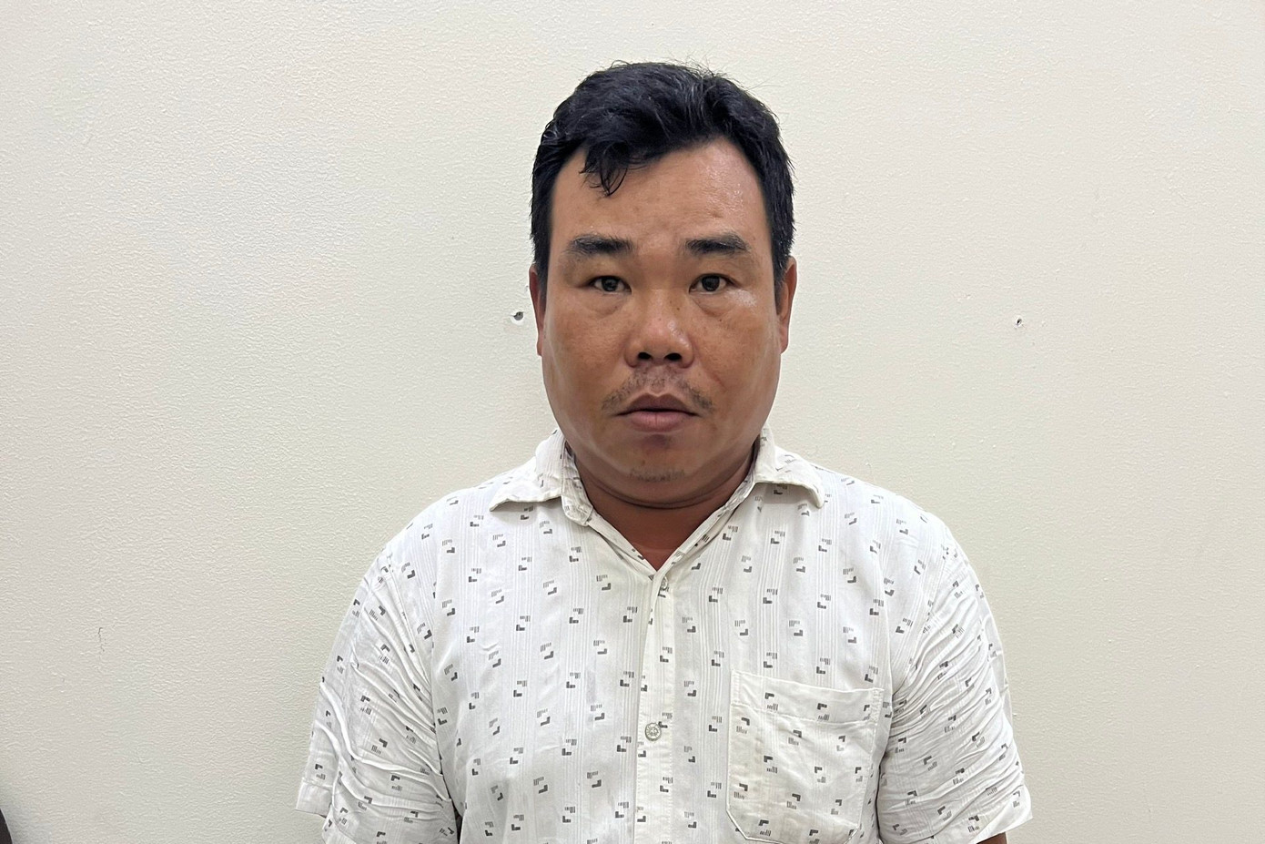 Phan Bảo Quốc tại cơ quan công an.