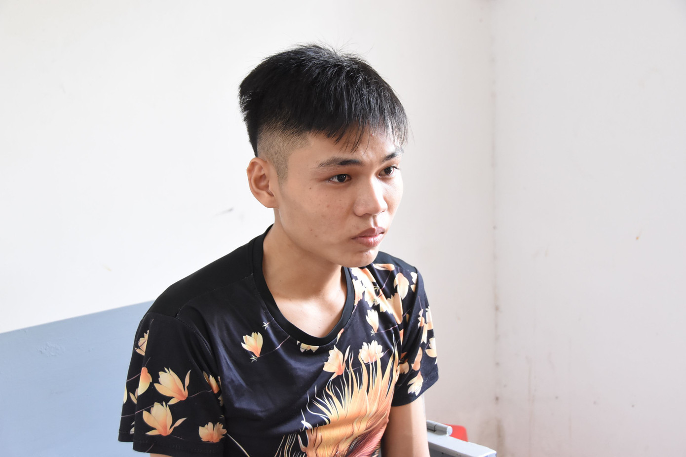 Nguyễn Bảo Quốc tại cơ quan công an. Ảnh: Lê Hoài.