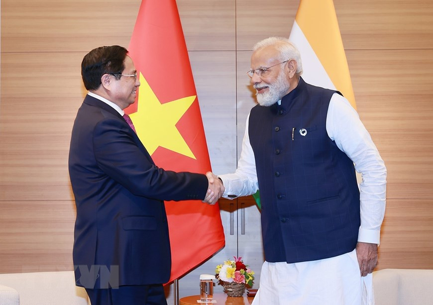 Thủ tướng Phạm Minh Chính gặp Thủ tướng Ấn Độ Narendra Modi. (Ảnh: Dương Giang/TTXVN)