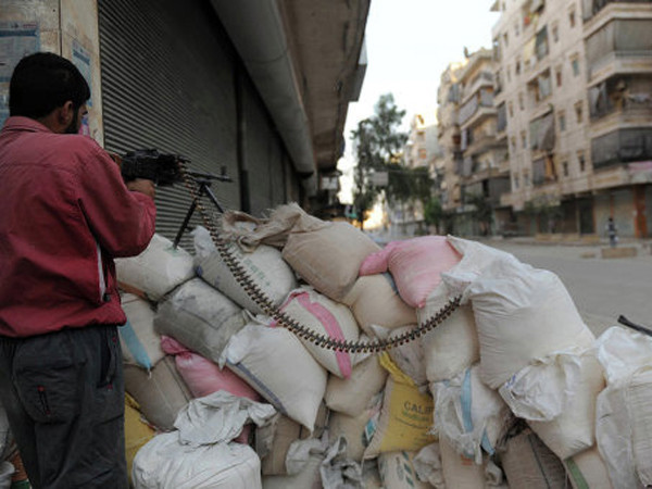 Tình hình tại một góc phố ở Syria. Ảnh: Ria-Novosti