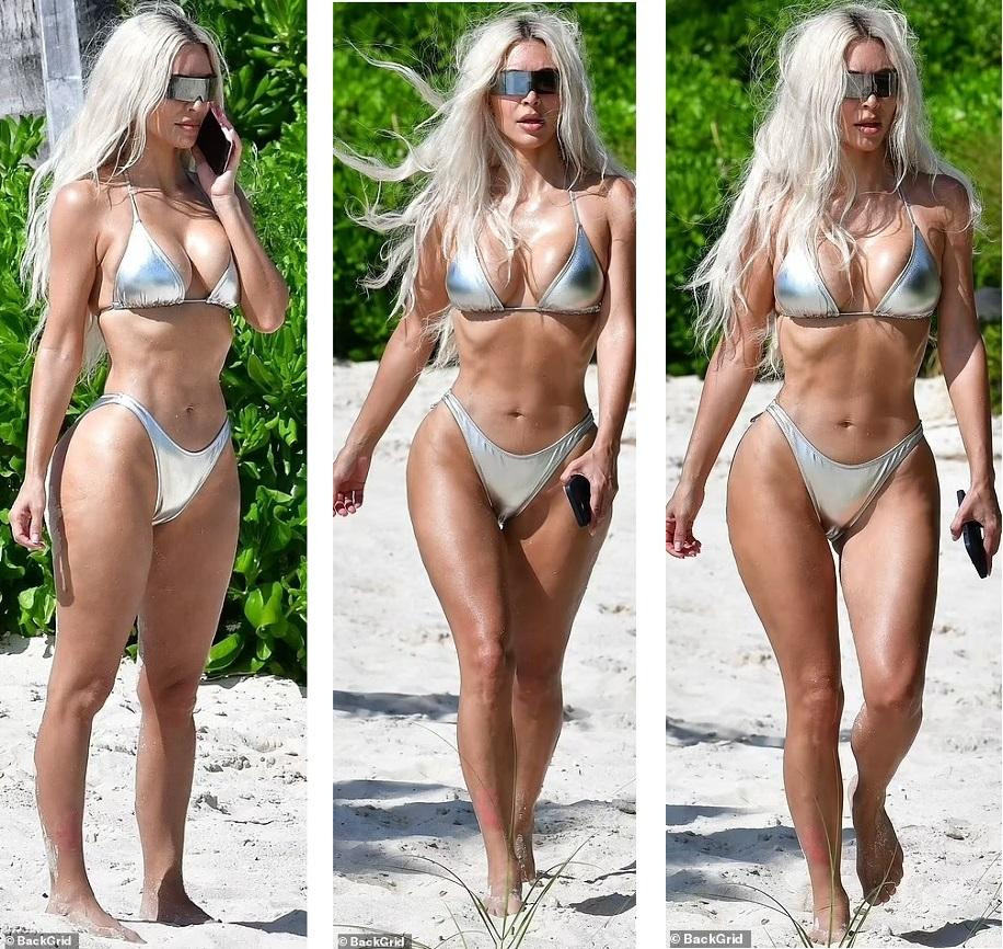 Kim Kardashian mặc bikini màu bạc tôn thân hình "đồng hồ cát" nóng bỏng. Mái tóc bạc và kính râm thời trang mang đến cảm giác Kim như một nhân vật trong phim khoa học viễn tưởng
