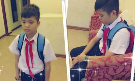 Quang Anh trong đồng phục học sinh. Bài viết: http://news.zing.vn/Quang-Anh-lam-gi-sau-The-Voice-Kids-post359359.html#home_featured.tinnong Nguồn Zing News 