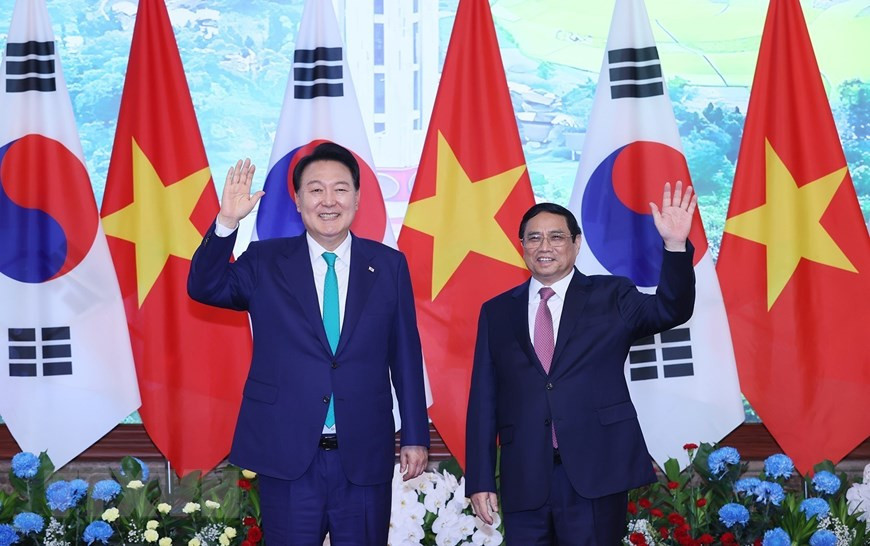 Thủ tướng Phạm Minh Chính và Tổng thống Hàn Quốc Yoon Suk Yeol chụp ảnh chung. (Ảnh: Dương Giang/TTXVN) Thủ tướng Phạm Minh Chính và Tổng thống Hàn Quốc Yoon Suk Yeol chụp ảnh chung. (Ảnh: Dương Giang/TTXVN)