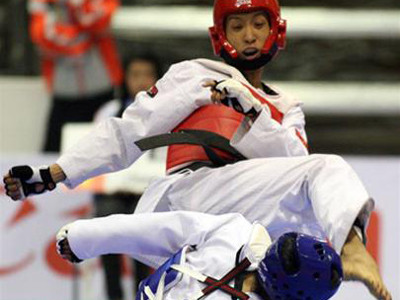 Huỳnh Châu (giáp đỏ) tại Sea Games 24. Ảnh: Tuổi trẻ