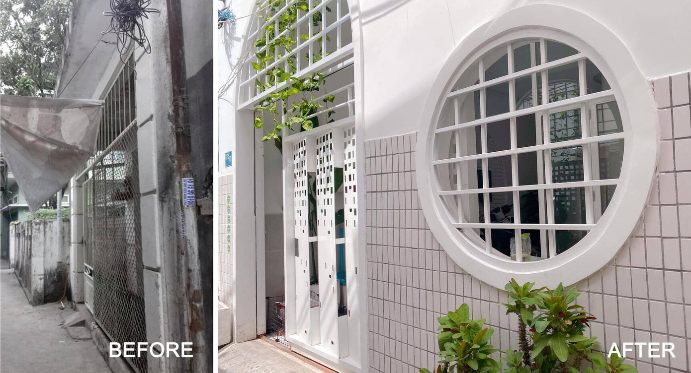 Để ngôi nhà đỡ nhàm chán về mặt thị giác, KTS lắp đặt ô cửa sổ tròn ở mặt tiền để tạo điểm nhấn. Cửa chính là dạng cửa sắt ray trượt, cánh cửa được khoét những ô vuông, chữ nhật to nhỏ khác nhau để không khí, nắng, gió vẫn “ra vào” nhà được.