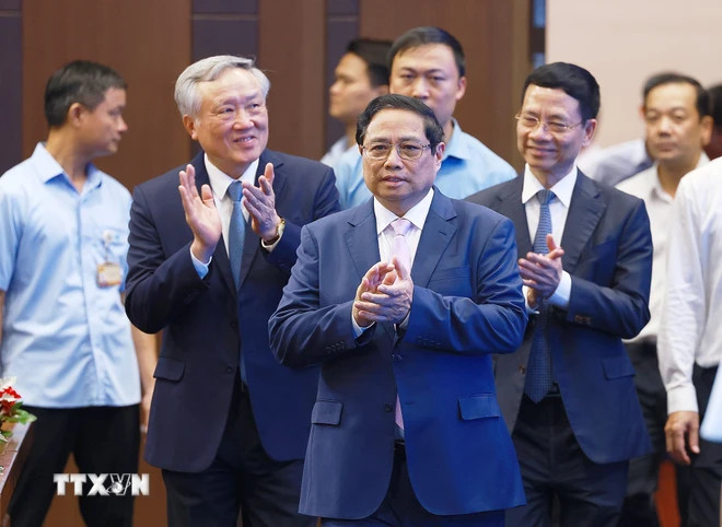 Thủ tướng Phạm Minh Chính dự Hội nghị giới thiệu mô hình chuyển đổi số thành công cấp bộ, ngành. (Ảnh: Dương Giang/TTXVN)