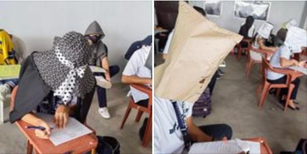 Ai cũng đội mũ khi làm bài thi. Ảnh: Mary Joy. Ai cũng đội mũ khi làm bài thi. Ảnh: Mary Joy.