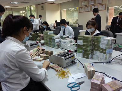 Nhiều ngân hàng khốn đốn với nợ xấu (ảnh minh họa). Ảnh: Phạm Tuyên