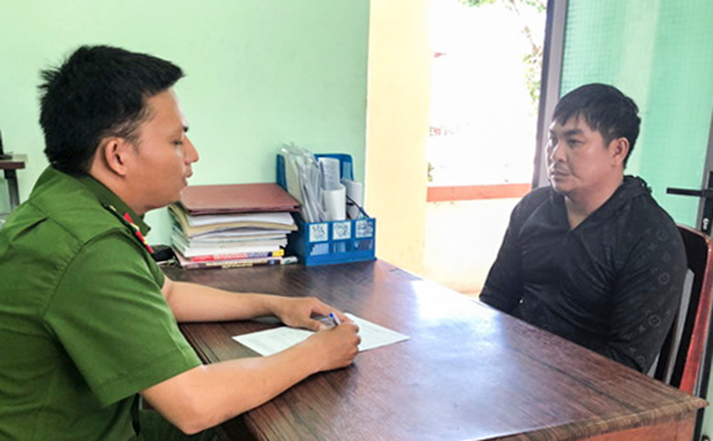 Đặng Văn Em tại cơ quan công an. Ảnh: N.G