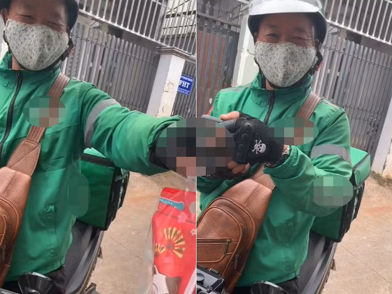 Người bố cười tít mắt khi giao trà sữa cho con gái mình. Ảnh: cắt từ clip (Diệu Linh) Người bố cười tít mắt khi giao trà sữa cho con gái mình. Ảnh: cắt từ clip (Diệu Linh)