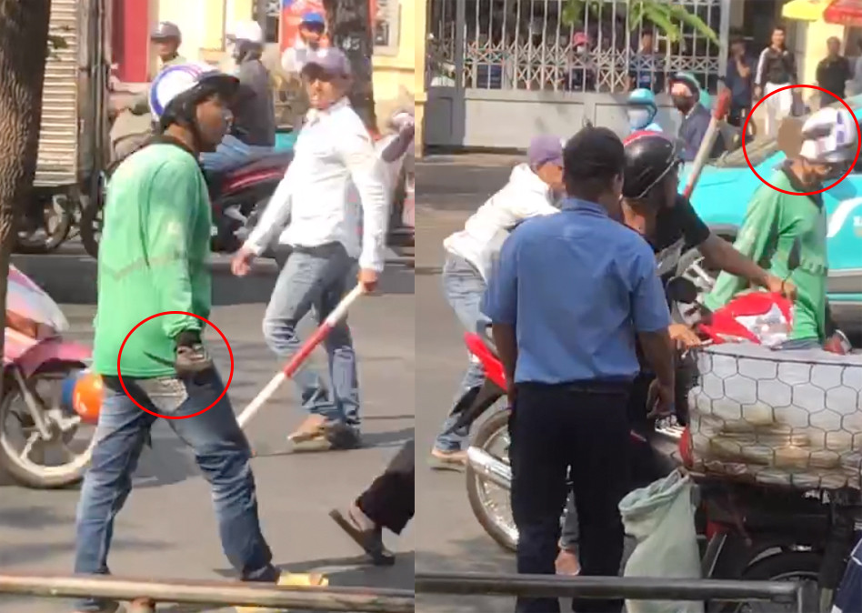 Tài xế xe ôm công nghệ cầm dao và bị một tài xế xe ôm truyền thống dùng gậy đập vào đầu làm vỡ mũ bảo hiểm.