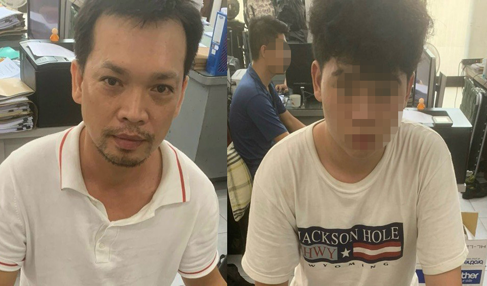 Nguyễn Thành Tây và con trai tại cơ quan công an. Ảnh: M.A.