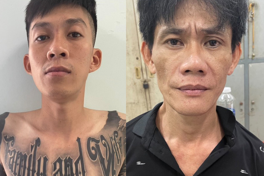 Trần Thế Hiển (bên trái) và Ngụy Lập Thanh tại cơ quan công an.