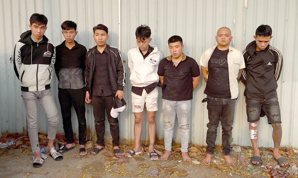 Vũ và đồng bọn lúc bị bắt. Ảnh: C.A.