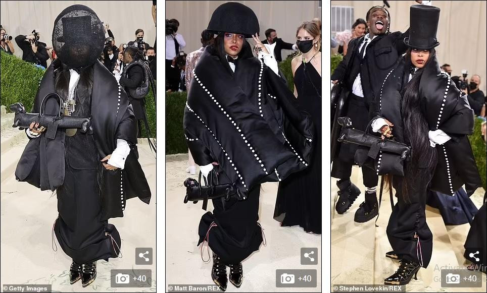 Những chiếc mặt nạ che kín mặt dường như là xu hướng năm nay. Tuy nhiên, cũng như Kim, Erykah Badu trông kỳ quái hơn là hợp thời trang. Bộ đồ công kềnh bất tiện, kèm theo chiếc túi xách hình con chó xúc xích khá dị.