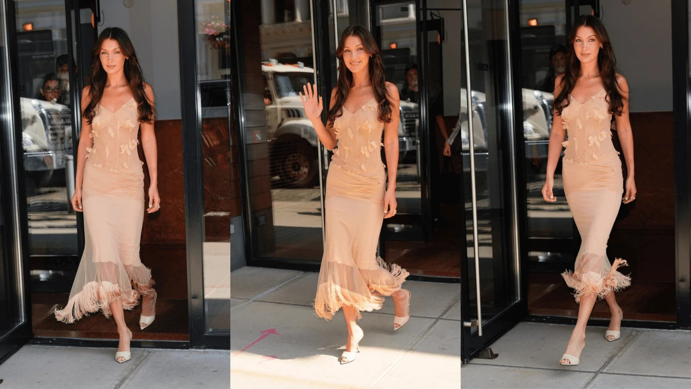 Bella Hadid xuất hiện quyến rũ trong một chiếc váy lưới vintage màu nude cổ chữ V thanh tao. Bella Hadid xuất hiện quyến rũ trong một chiếc váy lưới vintage màu nude cổ chữ V thanh tao.