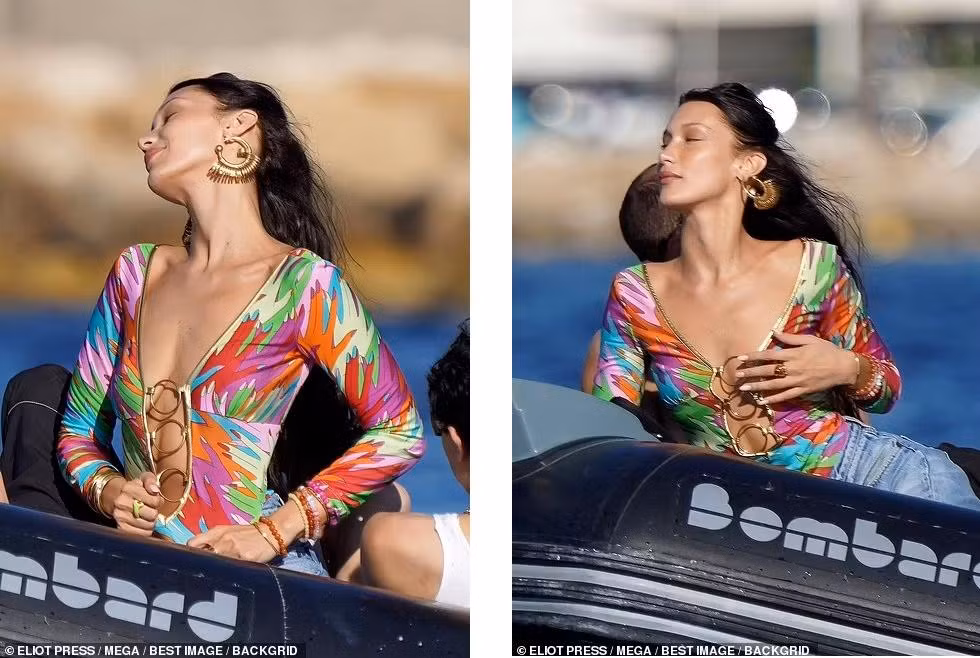 Có tình yêu tưới tắm, "chân dài" Victoria's Secret trông yêu kiều, ngọt ngào hơn hẳn. Trong buổi đi chơi, cô mặc áo dài tay bó sát người màu sắc sặc sỡ. Thiết kế xẻ sâu táo bạo "lấp ló" vòng một không nội y.