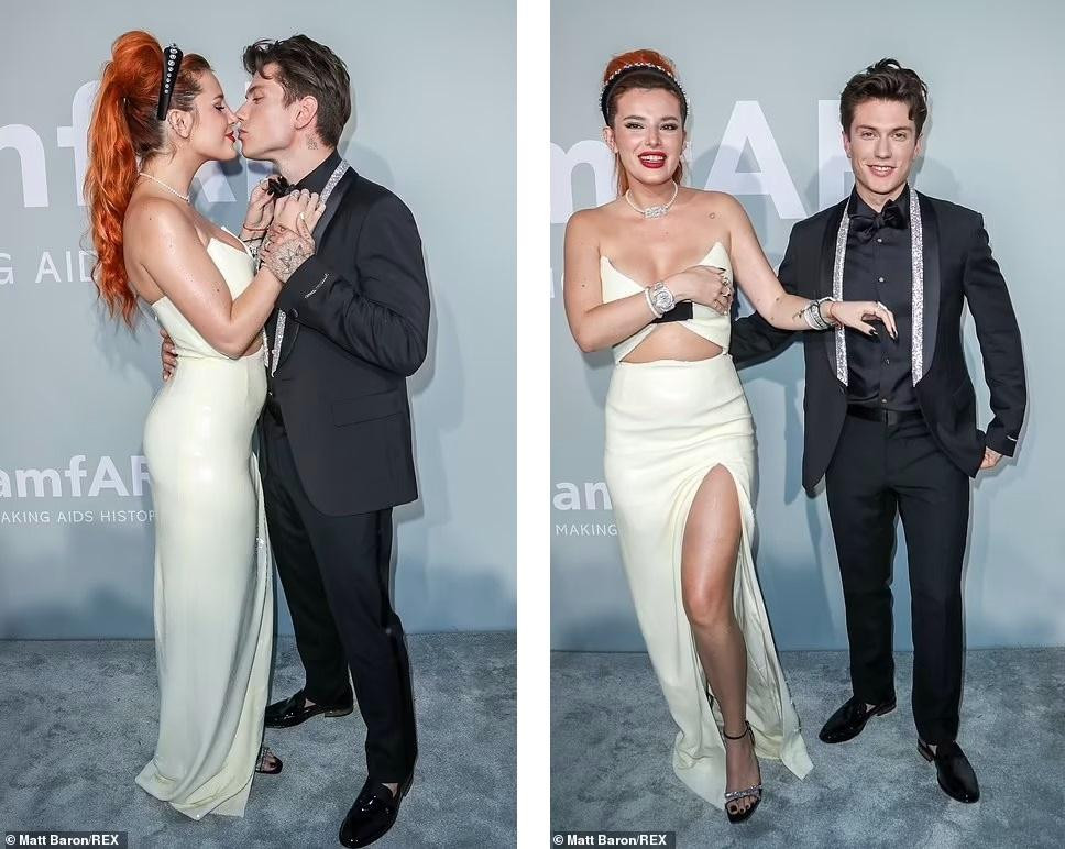 Nữ diễn viên Mỹ Bella Thorne tình tứ cùng vị hôn phu người Ý Benjamin Mascolo trước ống kính. Người đẹp 23 tuổi liên tục dùng tay che vòng một vì váy xẻ quá bạo.