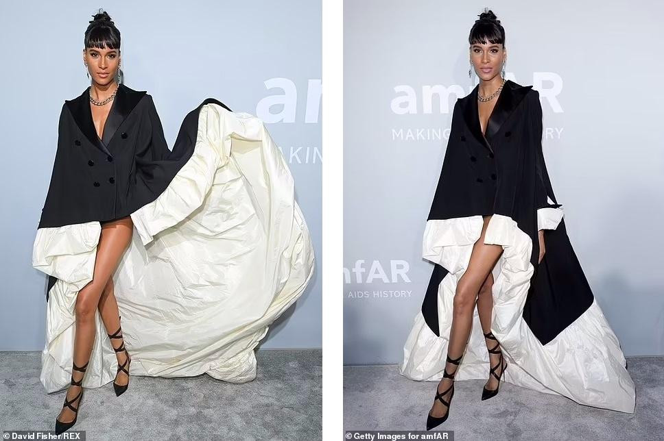 "Chân dài" nước Pháp Cindy Bruna mặc váy dạng vest với phần đuôi dài quét đất, còn phần trước không thể ngắn hơn.