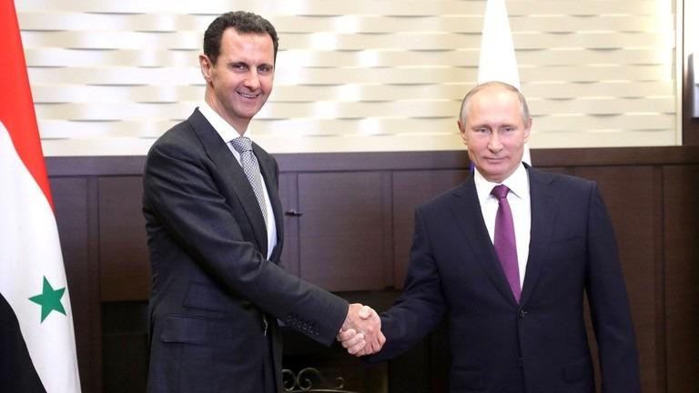Tổng thống Nga Vladimir Putin và Tổng thống Syria Bashar al-Assad. Ảnh: Getty