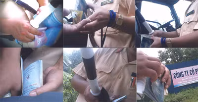 Cảnh đưa - nhận tiền tại một số chốt CSGT Thái Nguyên (ảnh trích từ clip). Cảnh đưa - nhận tiền tại một số chốt CSGT Thái Nguyên (ảnh trích từ clip)