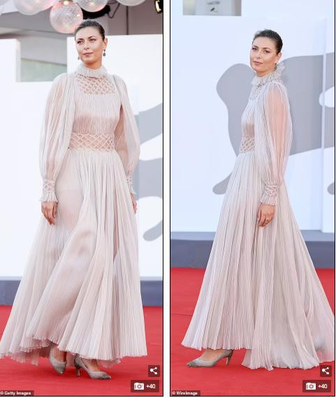 Cùng với lối trang điểm nhẹ nhàng, tóc búi cao càng tôn vẻ đẹp thanh lịch của người đẹp sinh năm 1987.