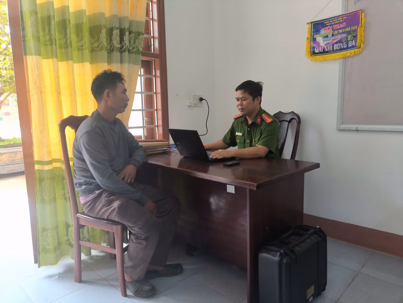 Ông Hồ Văn Định tại cơ quan công an