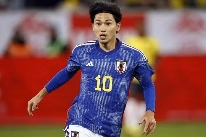 Takumi Minamino lần đầu cùng tuyển Nhật Bản tham dự World Cup 2022 tại Qatar. Anh từng được gọi là thần đồng bóng đá Nhật Bản và đang thi đấu ở vị trí tiền vệ, tiền đạo cho câu lạc bộ Monaco tại Ligue 1. Ảnh: Getty.