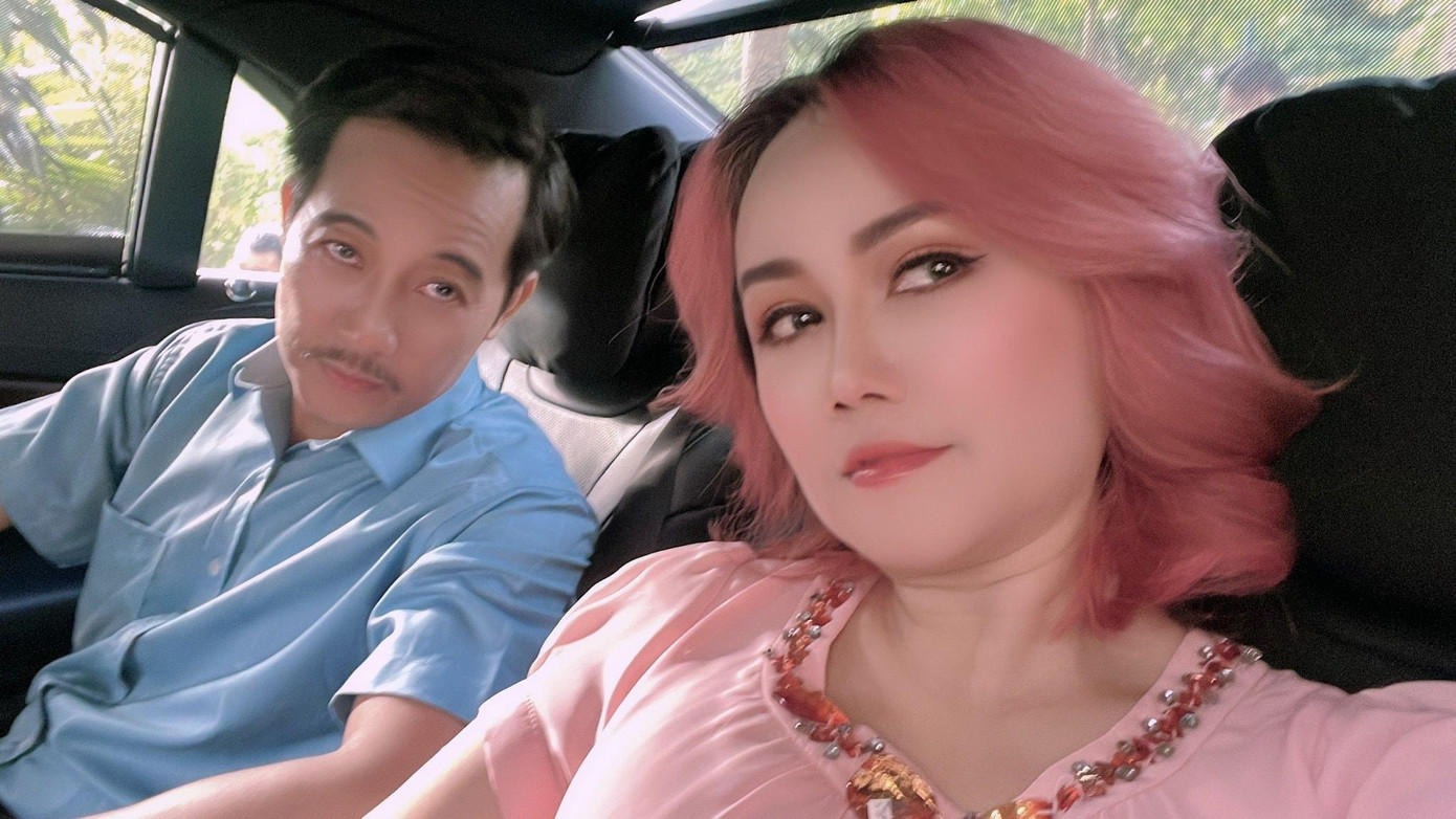 Vợ chồng Giám đốc CDC Đông Bình phim Đấu trí. Ảnh: NVCC.