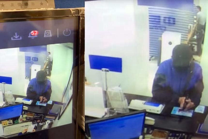 Nghi phạm cướp ngân hàng bằng một khẩu súng đồ chơi. Ảnh chụp từ camera an ninh