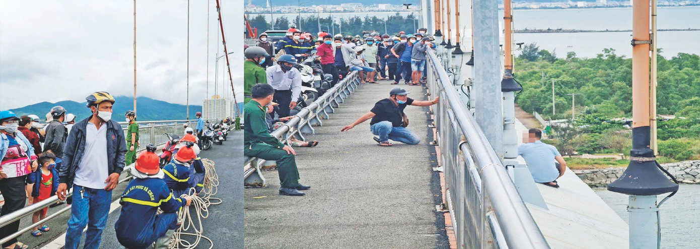 Lực lượng cứu hộ túc trực sẵn sàng trên cầu Thuận Phước trong khi chờ thuyết phục một người bỏ ý định nhảy cầu. Ảnh: CA