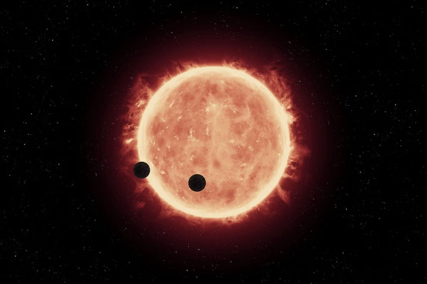 Hai ngoại hành tinh Trappist-1 đi qua ngôi sao của chúng (Ảnh minh họa) Hai ngoại hành tinh Trappist-1 đi qua ngôi sao của chúng (Ảnh minh họa)