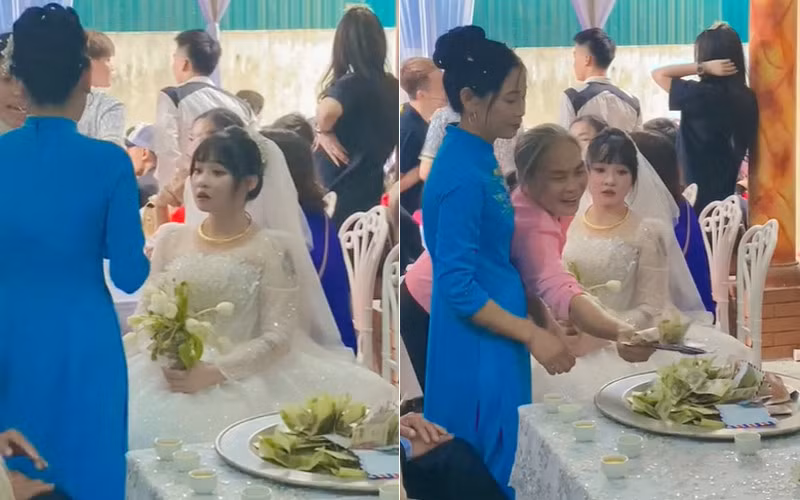Cô dâu ngơ ngác nhìn bà con trong làng kéo đến đặt tiền vào mâm. Ảnh cắt từ clip: Đăng Kiên Cô dâu ngơ ngác nhìn bà con trong làng kéo đến đặt tiền vào mâm. Ảnh cắt từ clip: Đăng Kiên