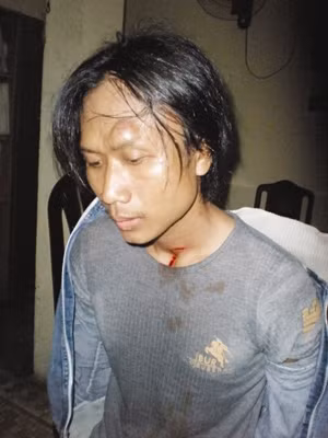 Hung thủ Cao Quốc Huy sau khi bị bắt giữ