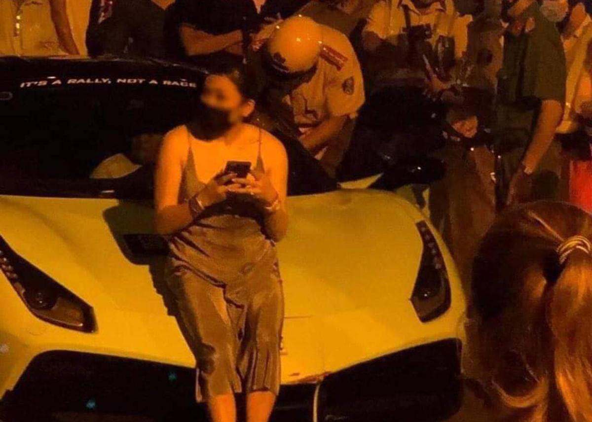 Trúc Giang ngồi trước đầu xe ô tô cản trờ tổ công tác cẩu chiếc xe này về trụ sở.