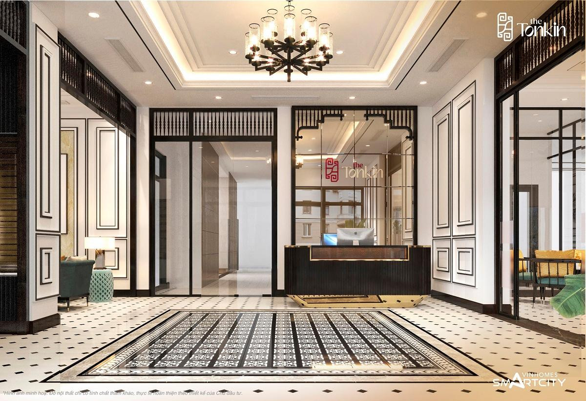 Sảnh lễ tân The Tonkin mang đậm chất Indochine với gạch bông hoa văn truyền thống, đèn trần, phào chỉ phong cách cổ điển và lam gỗ với họa tiết Á Đông.