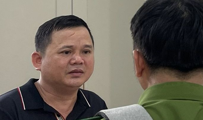 Lê Khắc Quốc tại cơ quan công an.