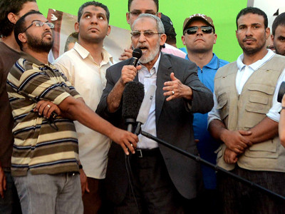 Ông Mohamed Badie lên án vụ quân đội phế truất Tổng thống Mohamed Morsi. Ảnh: CNN