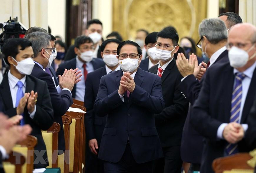 Thủ tướng Phạm Minh Chính đến dự buổi gặp các đối tác quốc tế đã hỗ trợ vắc xin phòng COVID-19 cho Việt Nam. (Ảnh: Dương Giang/TTXVN)