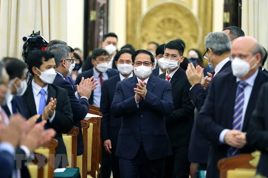 Thủ tướng Phạm Minh Chính đến dự buổi gặp các đối tác quốc tế. (Ảnh: Dương Giang/TTXVN)