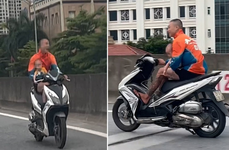 Hình ảnh nam thanh niên bế theo em bé điều khiển xe máy lao nhanh trên đường Vành đai 3 trên cao. Hình ảnh nam thanh niên bế theo em bé điều khiển xe máy lao nhanh trên đường Vành đai 3 trên cao.