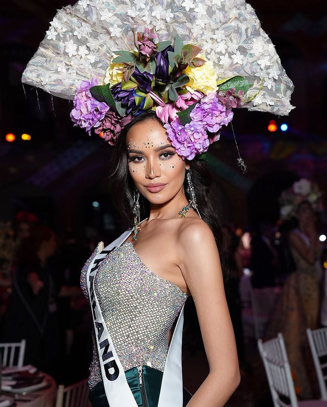 Trong những ngày tham gia cuộc thi, Opal có sự thể hiện nổi bật. Cô nhận được sự chú ý của khán giả, truyền thông. Người đẹp Thái Lan năm nay 20 tuổi, là sinh viên Luật tại Đại học Thammasat, chuyên ngành Quan hệ Quốc tế. Cô cao 1,8 m, hình thể thanh mảnh. Cô từng giành ngôi á hậu 2 ở Hoa hậu Hoàn vũ Thái Lan 2022.