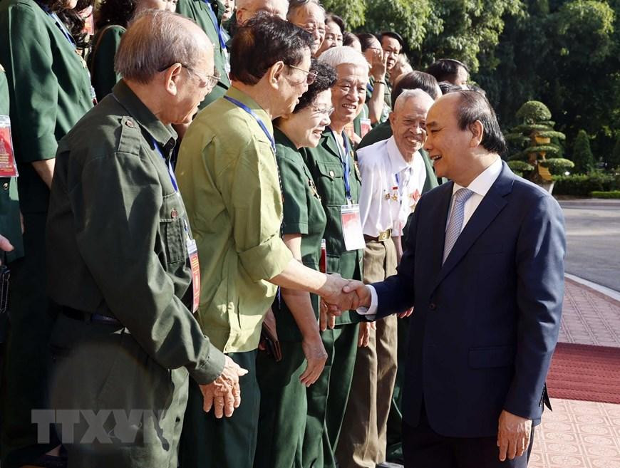 Chủ tịch nước Nguyễn Xuân Phúc với các đại biểu. (Ảnh: Thống Nhất/TTXVN)